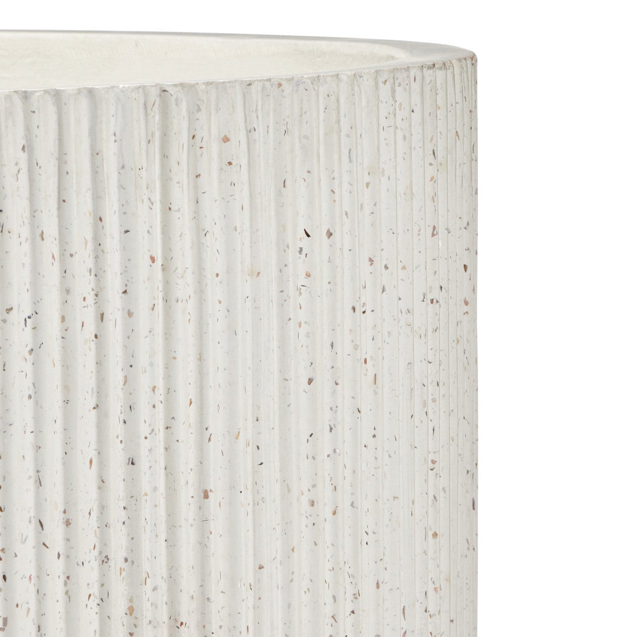 Close-up of a cylindrical planter or vase with a ribbed, vertically fluted texture in off-white with small speckled mineral-like inclusions, shown against a plain white background.