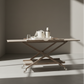 Wooden table with a minimalistic design in a room with sunlight casting shadows. bromley