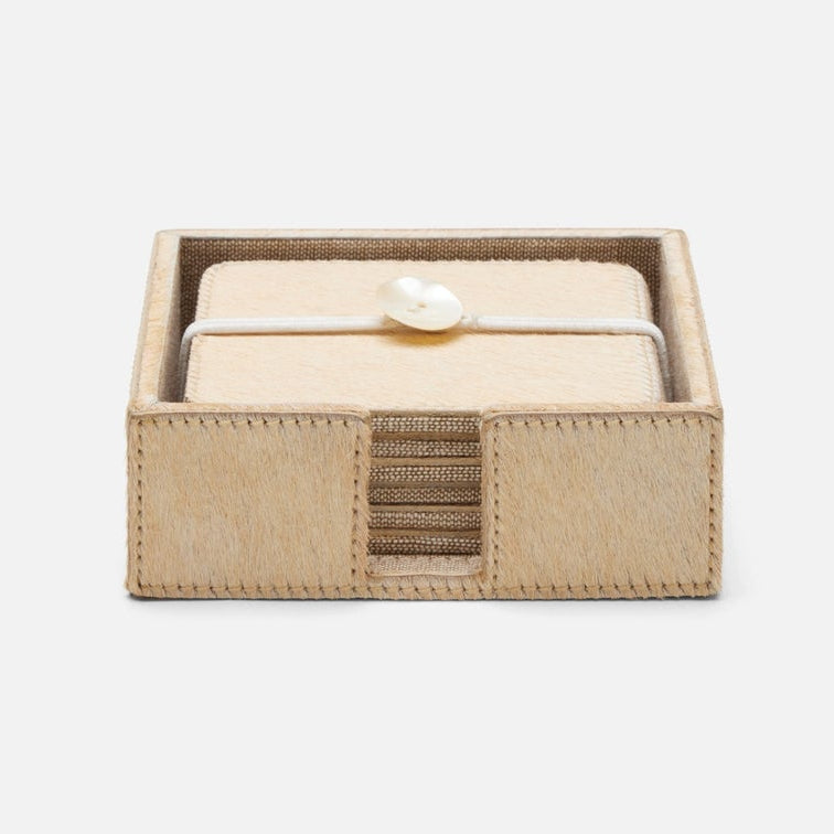 A set of coasters in beige hair on hide