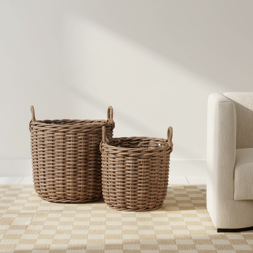 Two wicker baskets on a checkered floor with a neutral wall and sofa in the background.