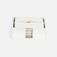 a square coaster set in white leather