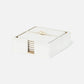 a square coaster set in white leather