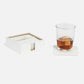 a square coaster set in white leather