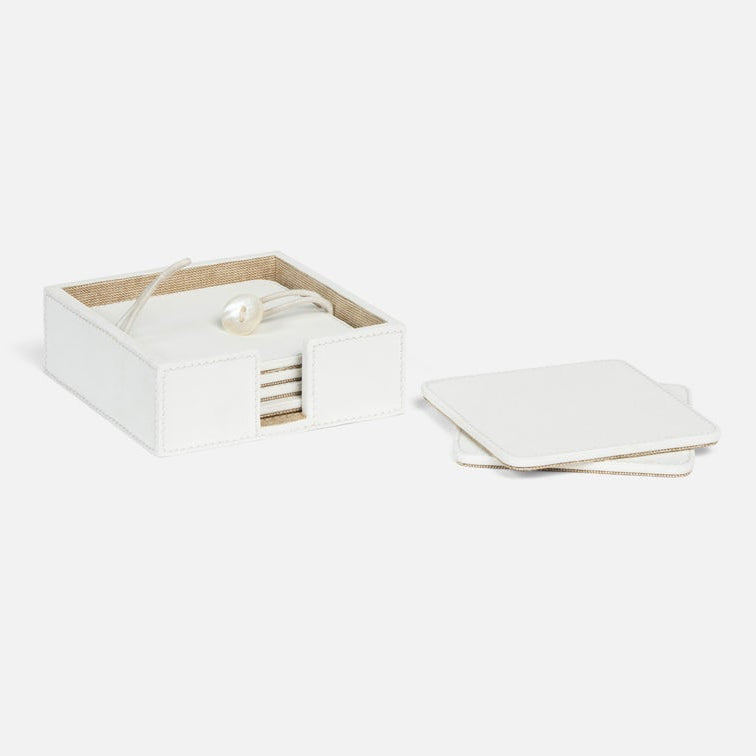 a square coaster set in white leather