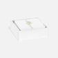 a square coaster set in white leather