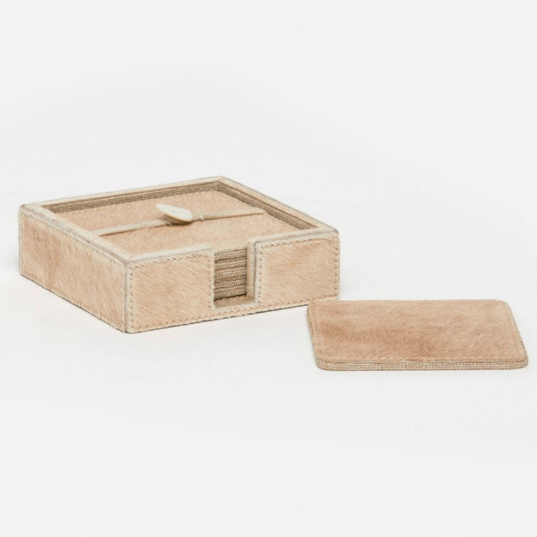 A light beige hair-on-hide coaster set