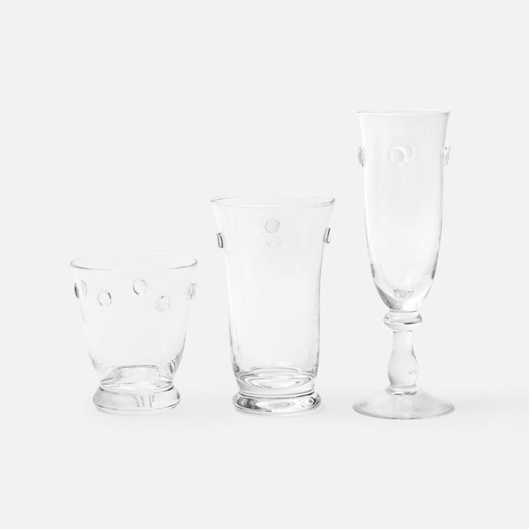 Three clear glass drinking glasses of different shapes on a white background