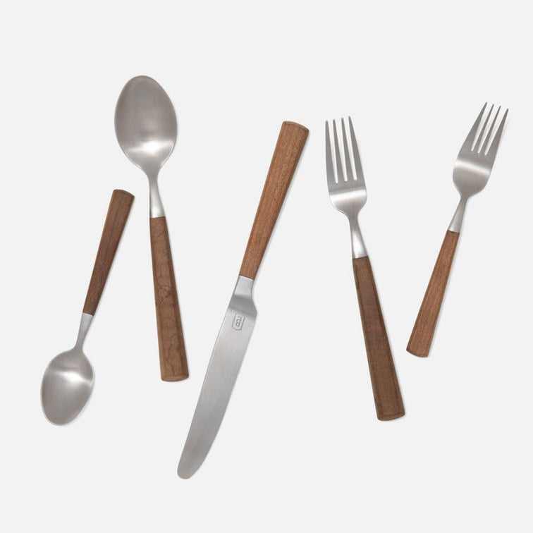 Five-piece flatware set with polished silver metal heads and warm brown wooden handles