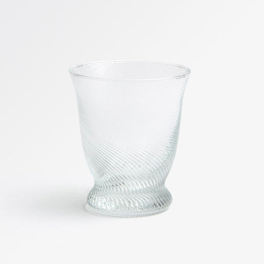 A clear textured glass tumbler with a spiral ribbed pattern, shown on a clean white background.
