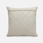 Quilted beige pillow on a white background