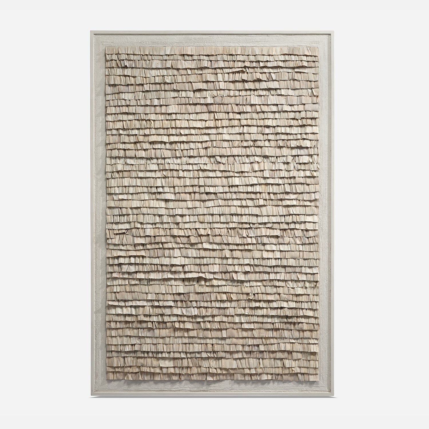 Textured wall art in a silver frame on a white background