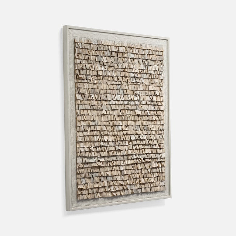 Framed textured wall art on a white background