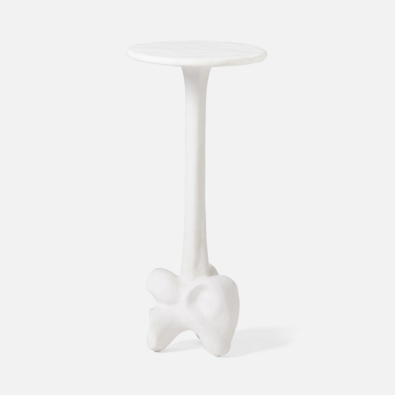 White side table with a unique design on a light gray background