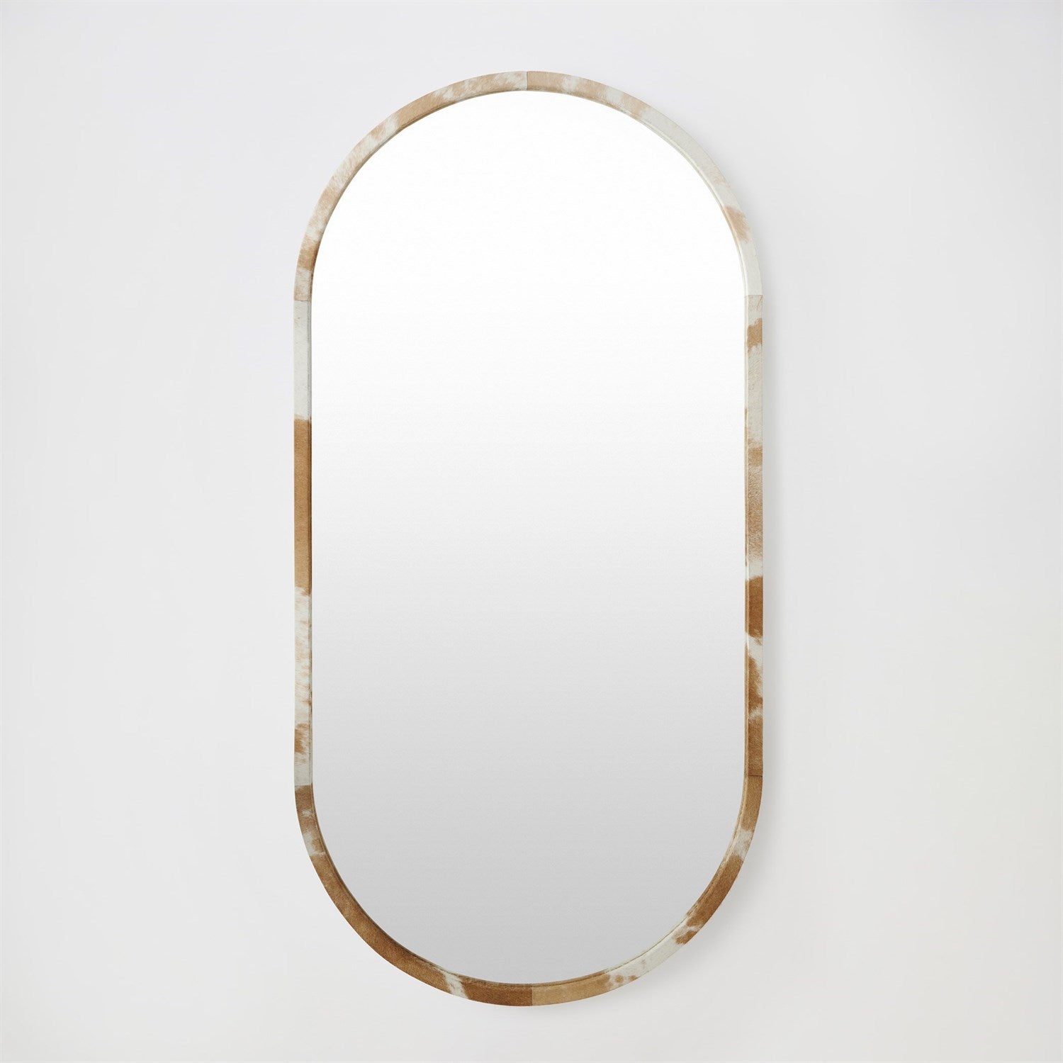 Oval mirror with a decorative frame on a white background