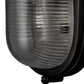 Black outdoor light fixture with ribbed glass cover on a white background