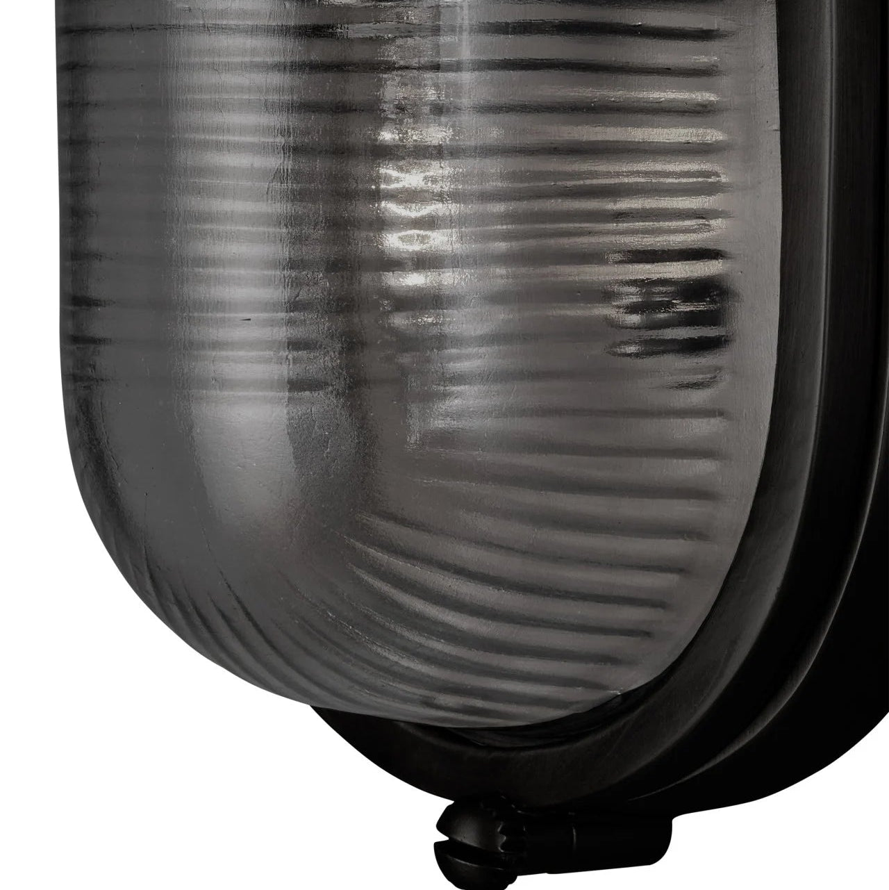 Black outdoor light fixture with ribbed glass cover on a white background