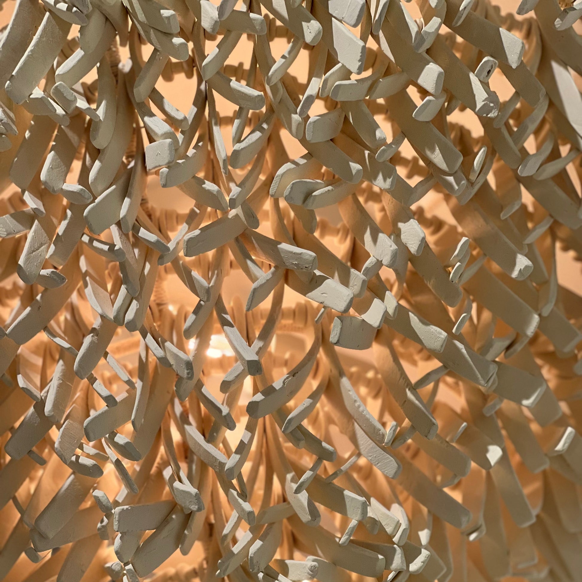 Close-up of a textured beige wall with a geometric pattern