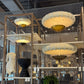 Modern interior design with pendant lights, chairs, and decorative items.