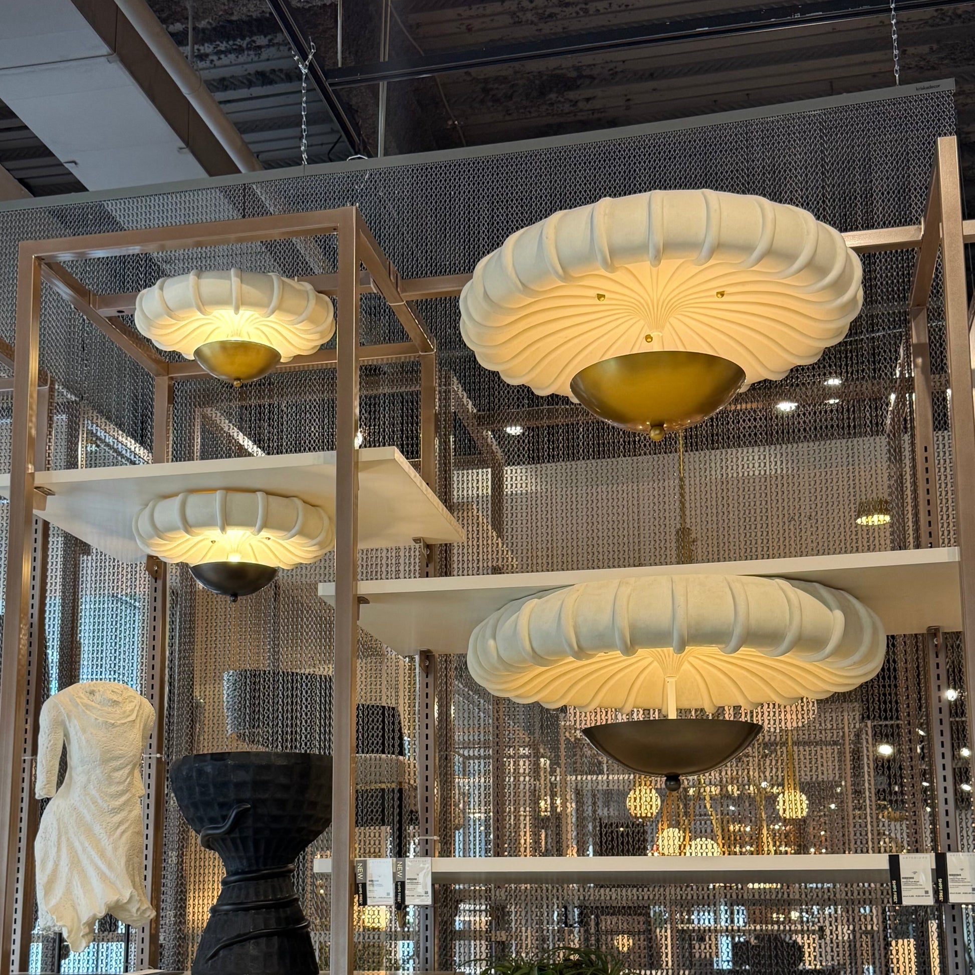 Modern interior design with pendant lights, chairs, and decorative items.