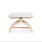 Modern stool with a white cushioned seat and wooden legs on a white background