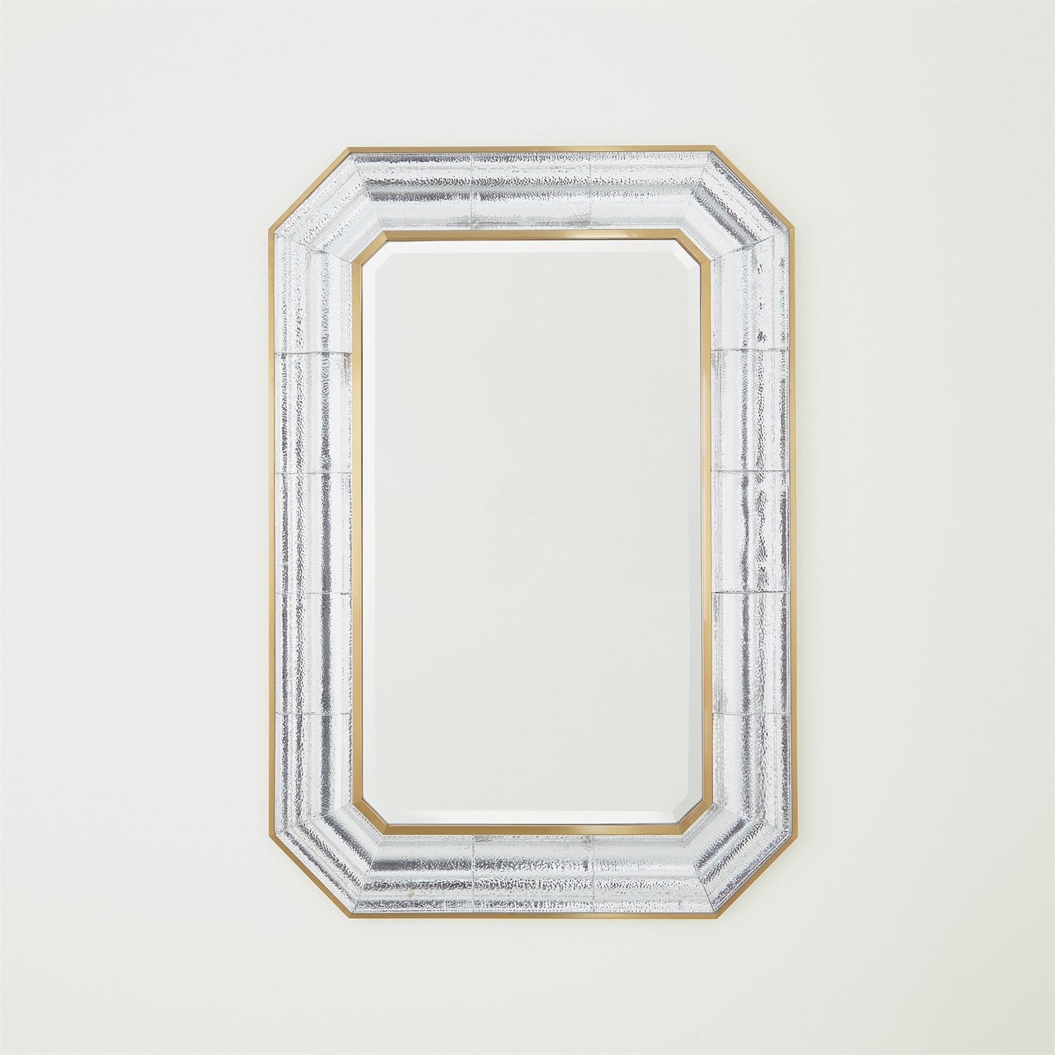 Decorative mirror with a gold and silver frame on a white background