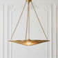 Gold pendant light fixture hanging against a white wall with decorative molding.