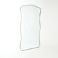 Rectangular mirror with a gold frame on a white background