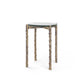 Small round table with unique bamboo-like legs on a white background