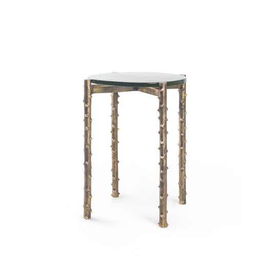 Small round table with unique bamboo-like legs on a white background