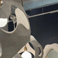Decorative mirrors with a modern design on a dark wall.