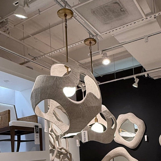 Modern interior design with chairs, mirrors, and decorative elements in a stylish setting.