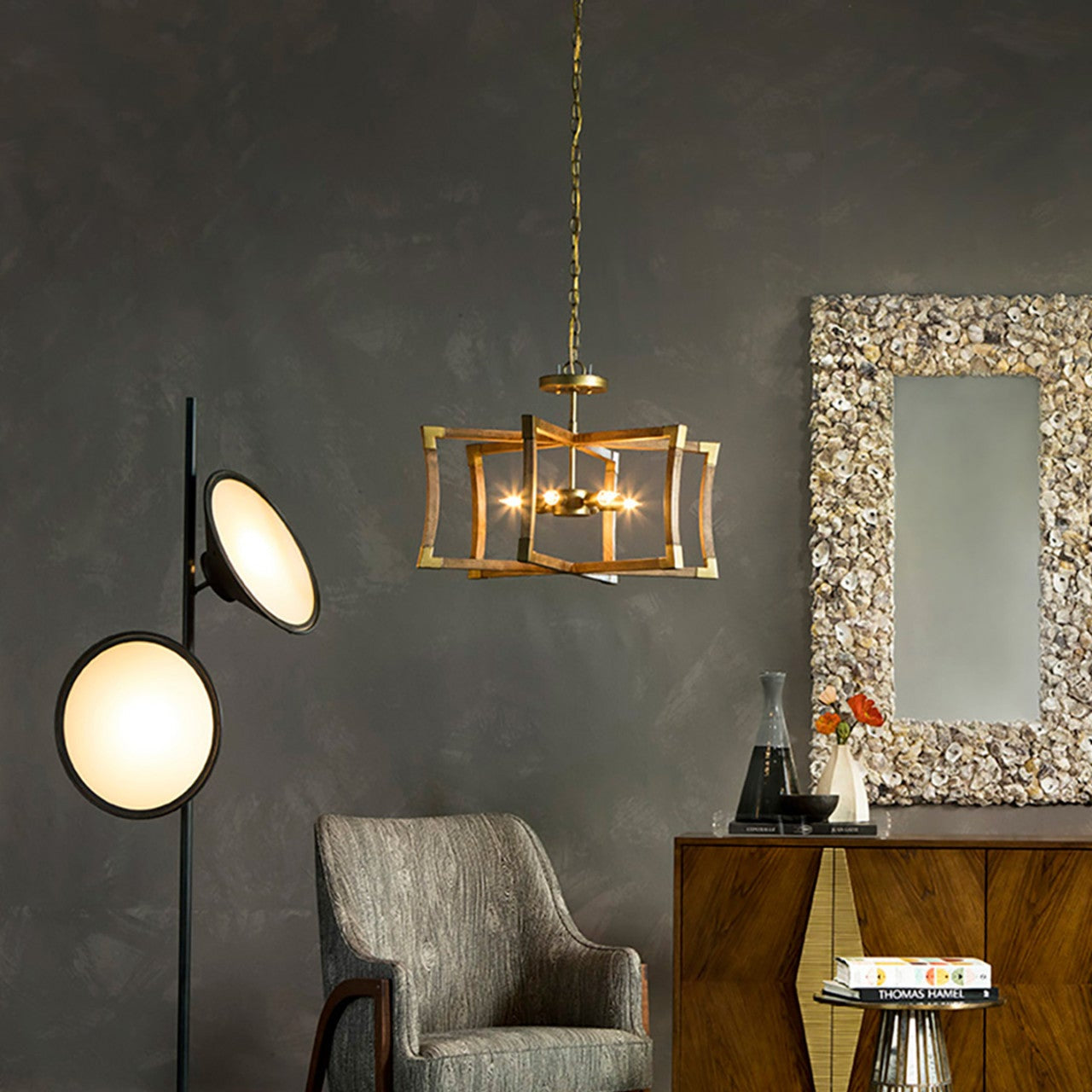 Modern interior with a floor lamp, chair, and decorative mirror.