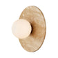 Beige wall sconce with a round light bulb on a white background