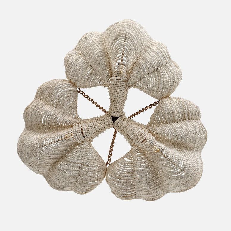 Beaded clutch bag with a chain strap on a white background