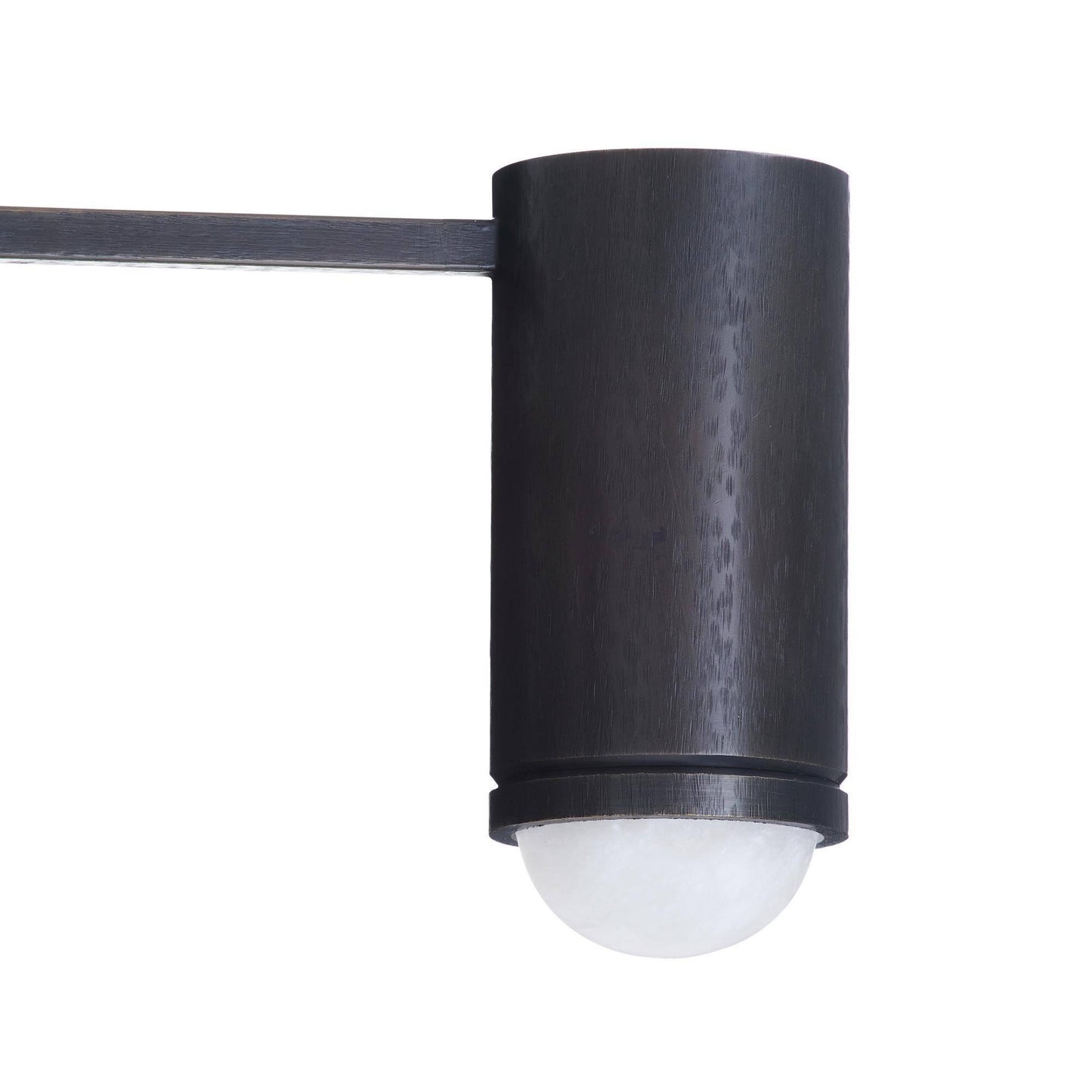Black cylindrical outdoor light fixture on a white background