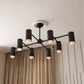 Modern black chandelier with multiple lights on a ceiling