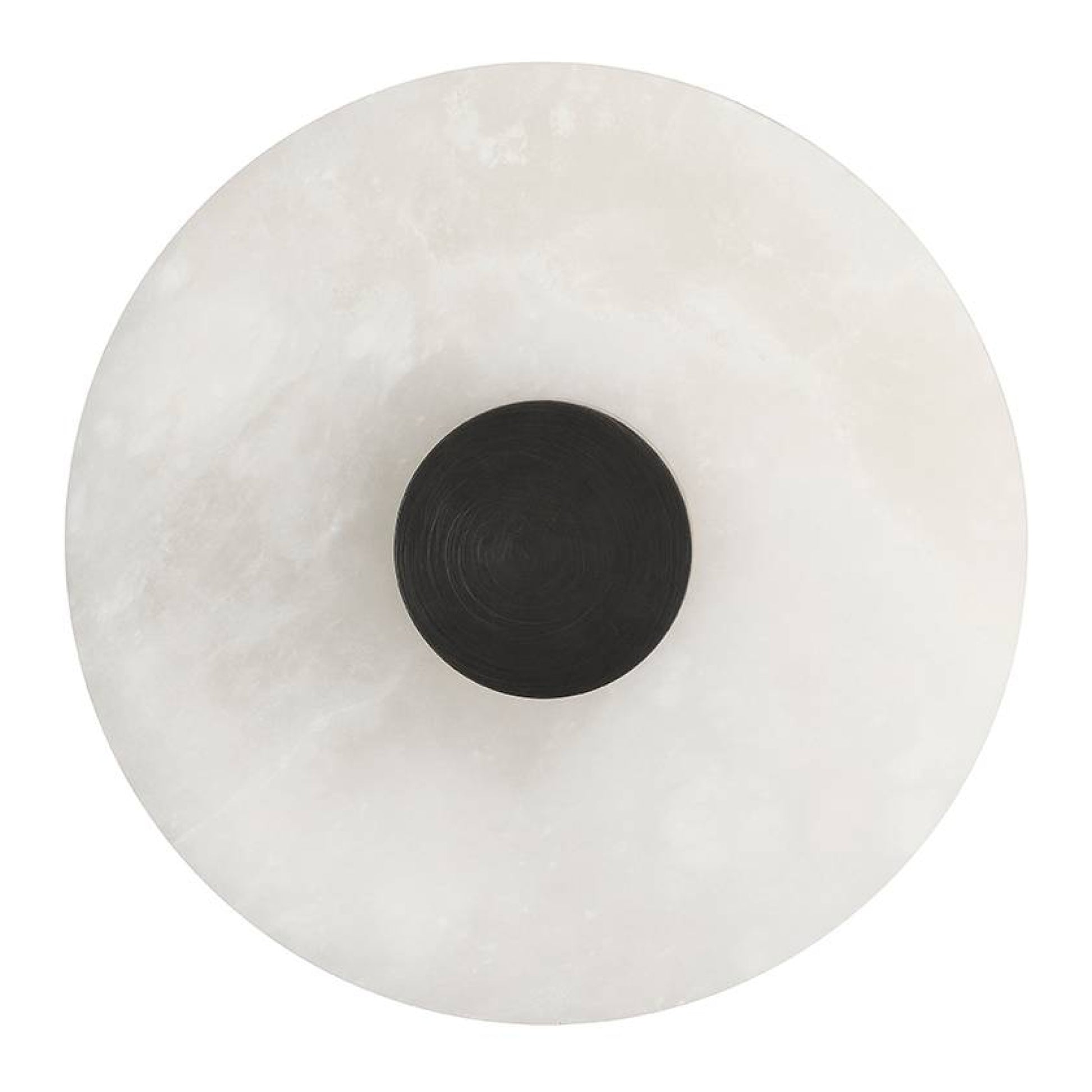 Round white object with a black center on a white background