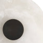 Black circular object on a white background