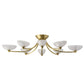 Gold chandelier with white shades on a white background