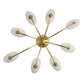 Gold sputnik chandelier with white oval shades on a white background
