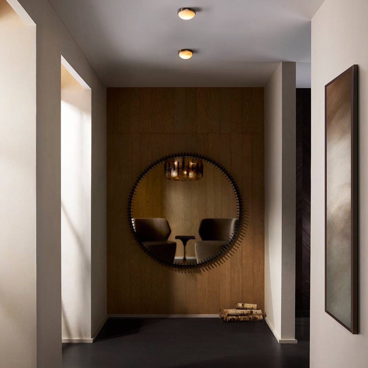 Modern interior with a round mirror on a wooden wall
