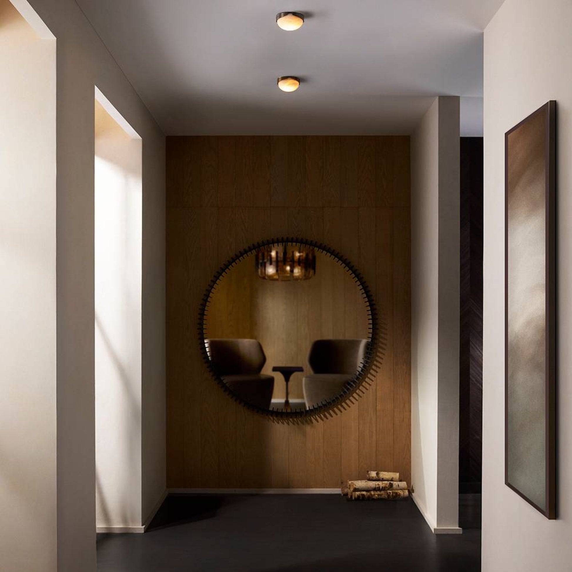 Modern interior with a round mirror on a wooden wall