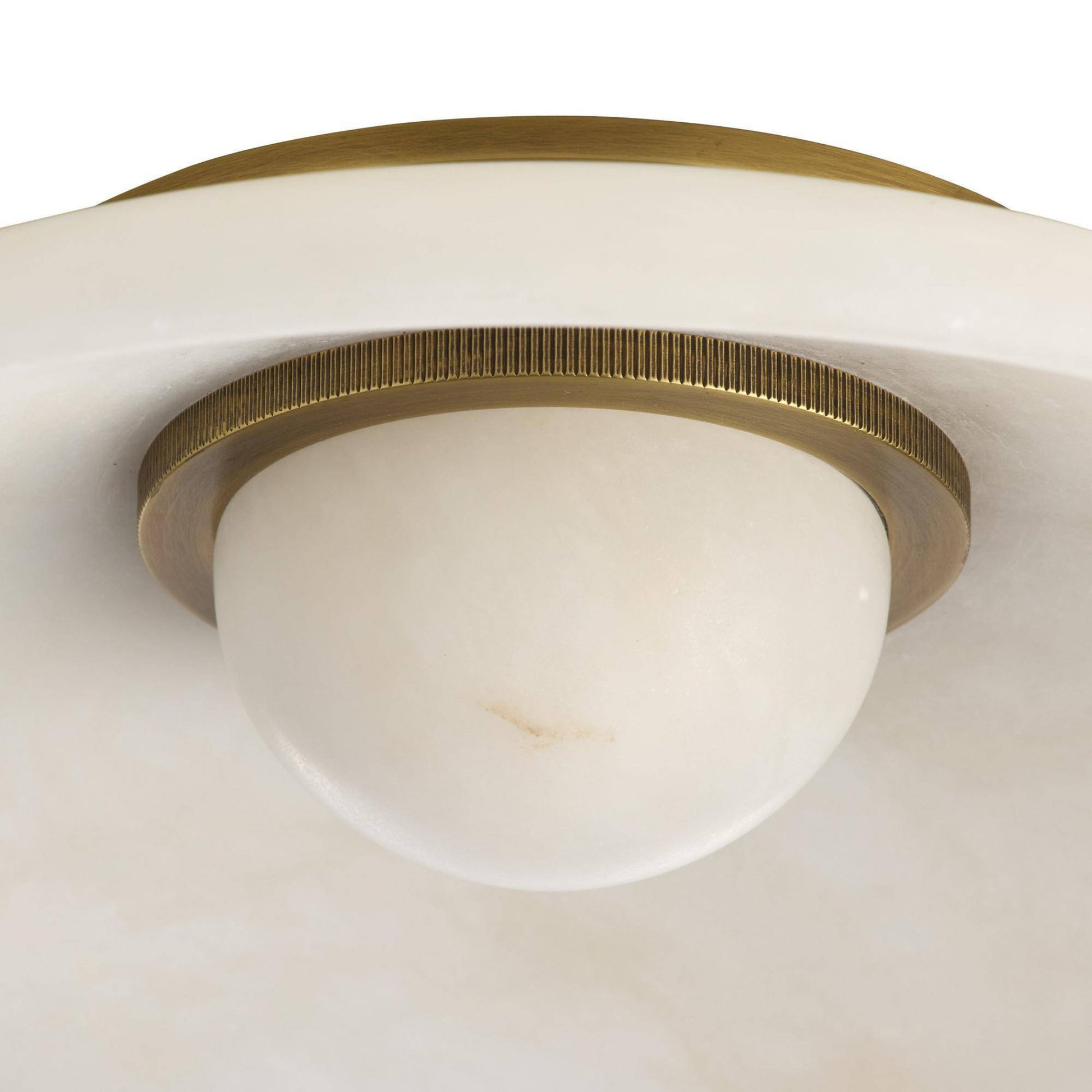 Ceiling light fixture with brass finish and white glass shade on a white background