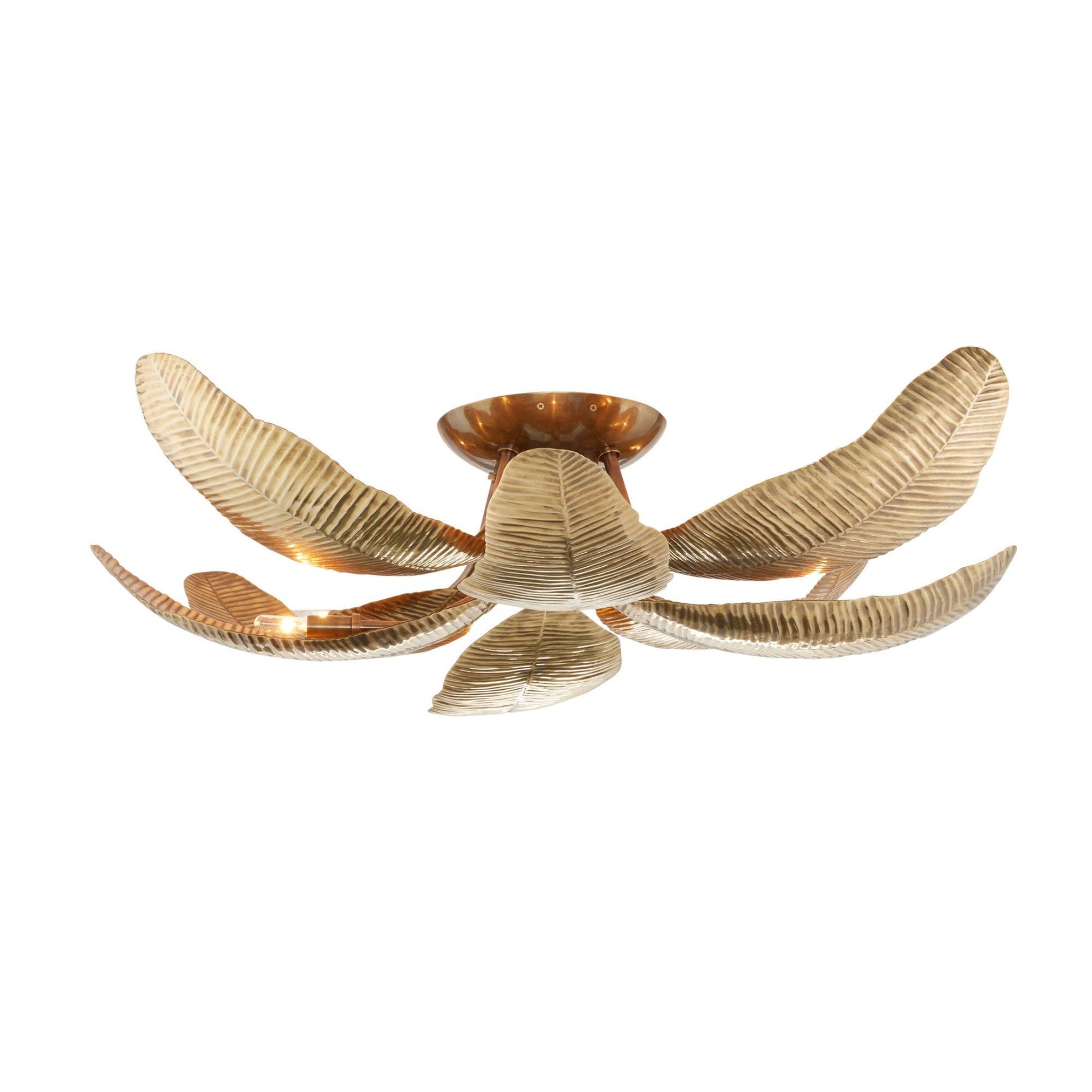 A modern ceiling light fixture with six curved, ribbed leaf-like shades in a brushed gold finish, arranged in a radial pattern around a central amber-brown glass cup.