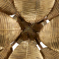 Close-up of a chandelier with leaf-like glass shades.