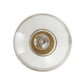 Clear plastic disc with a central circular component on a white background