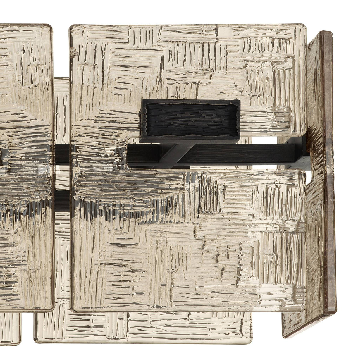 Abstract textured sculpture with geometric patterns on a white background