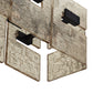 Decorative wall light fixture with textured metal finish on a white background