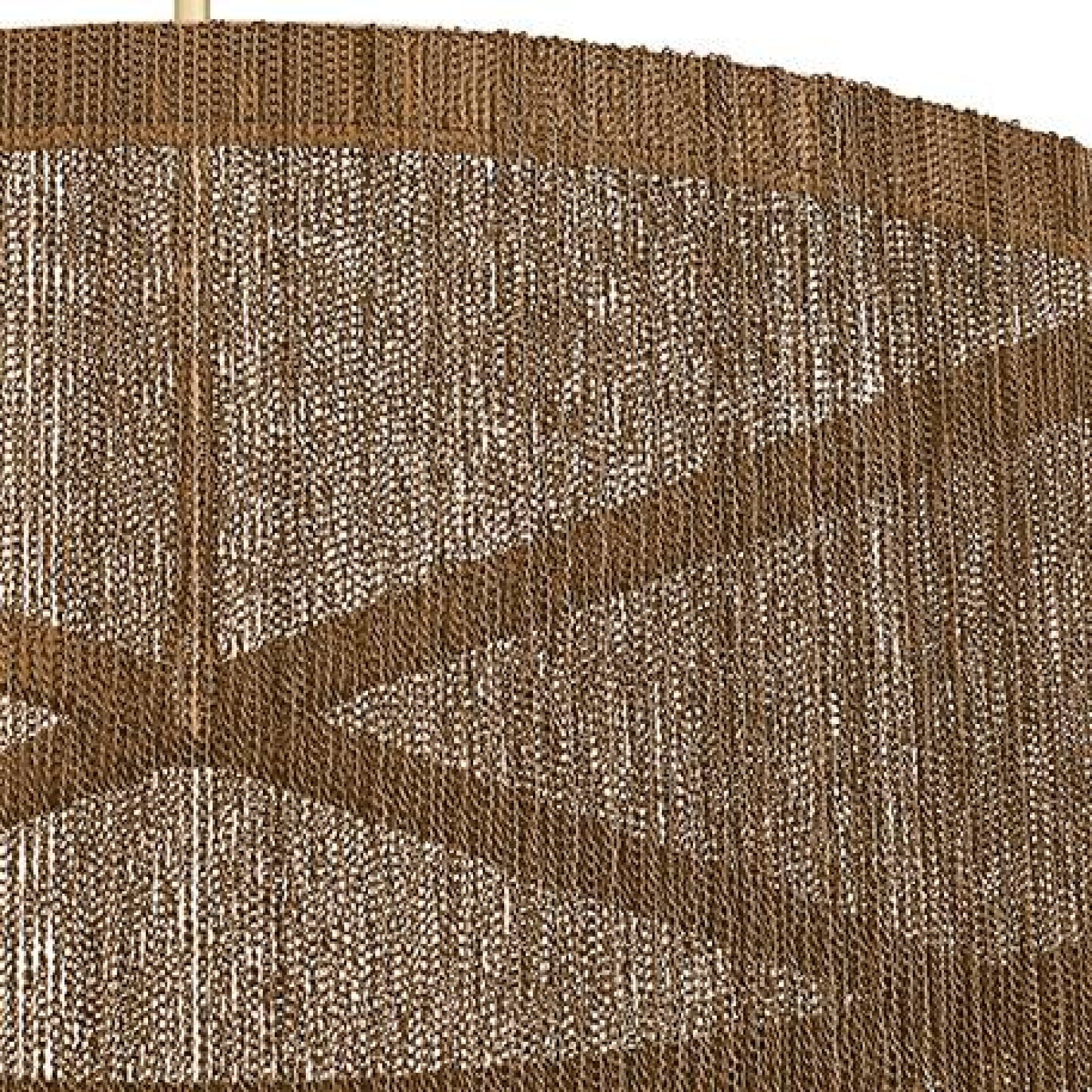 Close-up of a textured brown and beige fabric with a subtle pattern