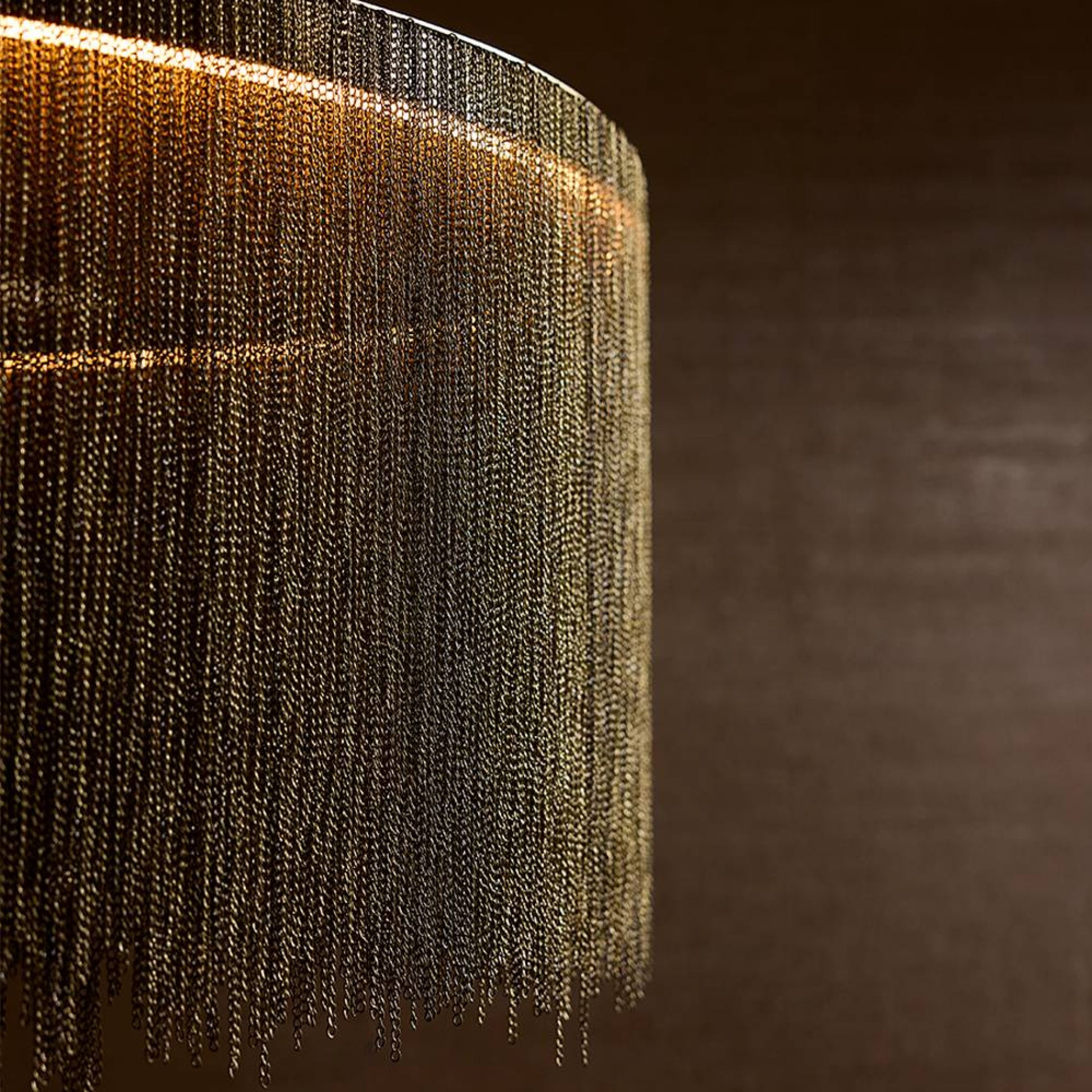 Close-up of a textured surface with chain-like material against a dark background